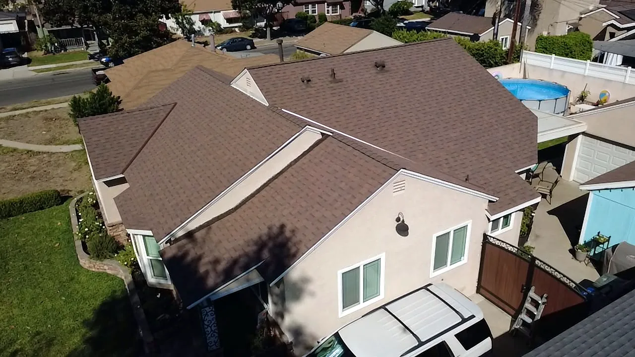 Multi-plane Copper Trail shingle roof on a Lakewood home, street-side aerial