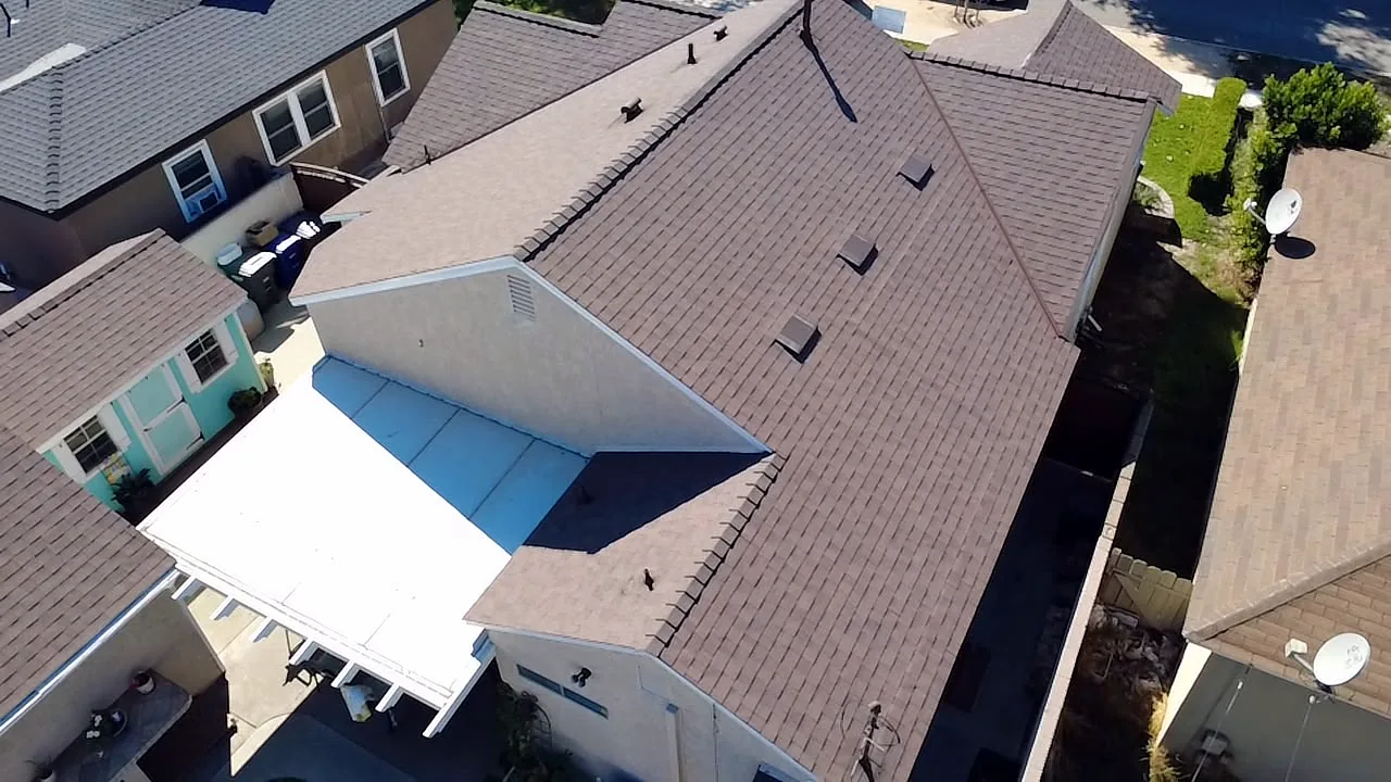 Rear gable and patio cover beside a Copper Trail shingle roof, Lakewood