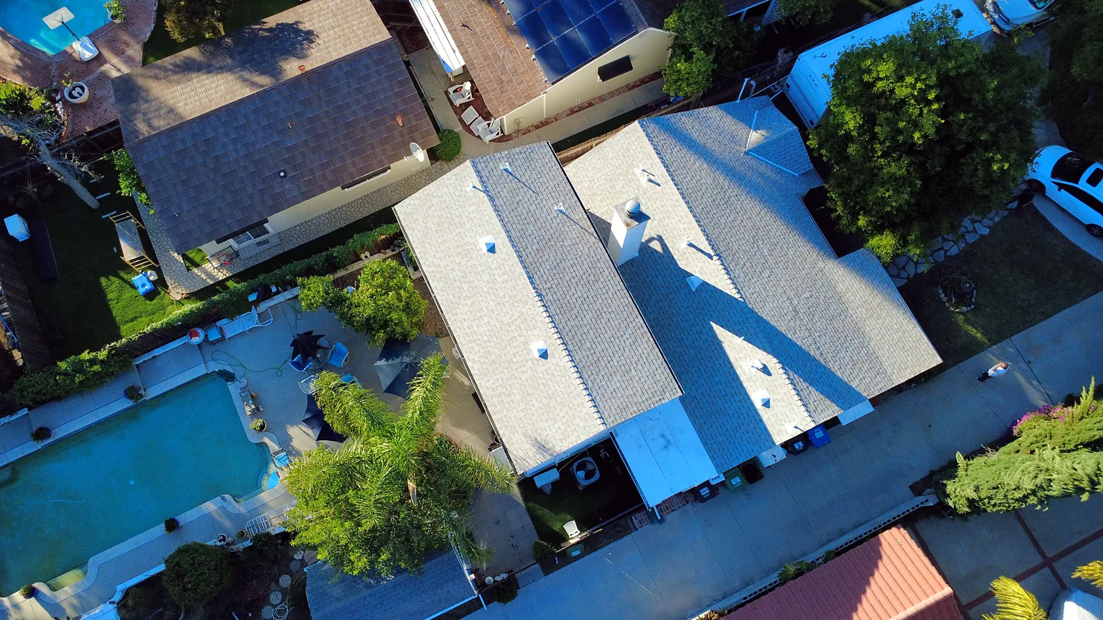 Light gray architectural shingle roof and pool yard in Woodland Hills, San Fernando Valley